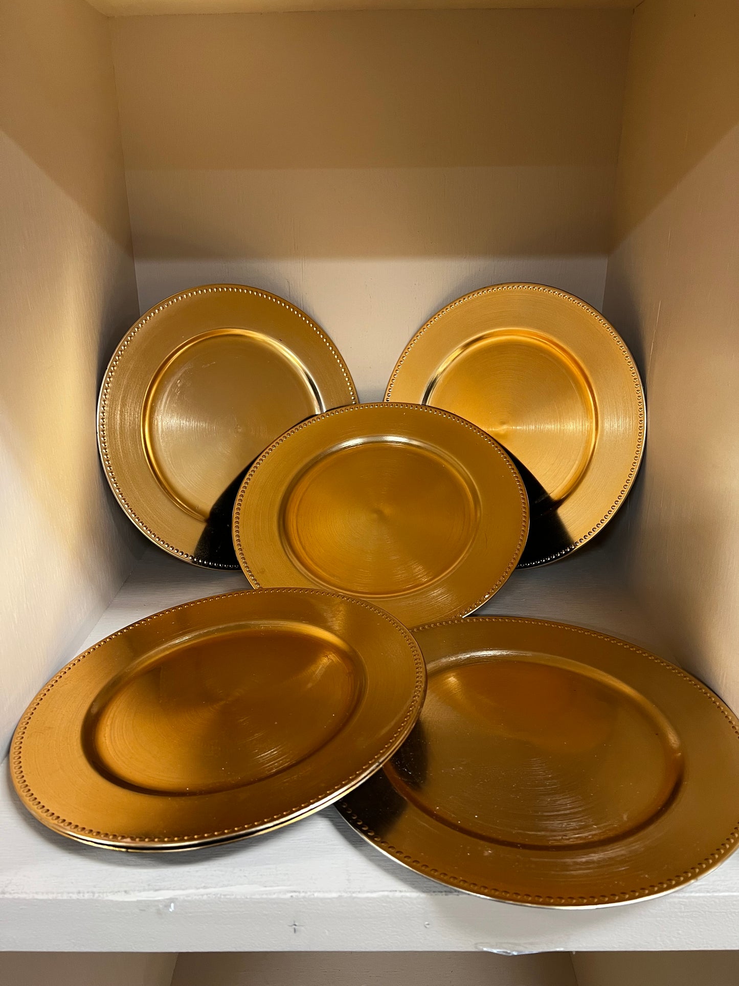 Gold Chargers. 9 boxes of 6 in good condition, plastic. 13" round